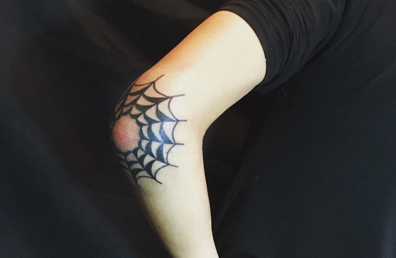 Spider Web Tattoo On Elbow Meaning
